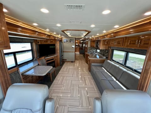 Table will extend and 2 additional chairs in RV storage. 
Sofa has a fold out queen size bed with comfort mattress. (Very Comfortable)