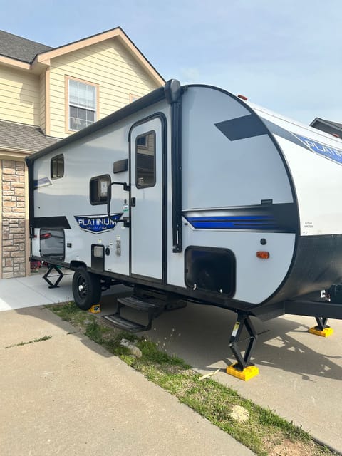 Included is an outdoor kitchen, awning, and solar panel.