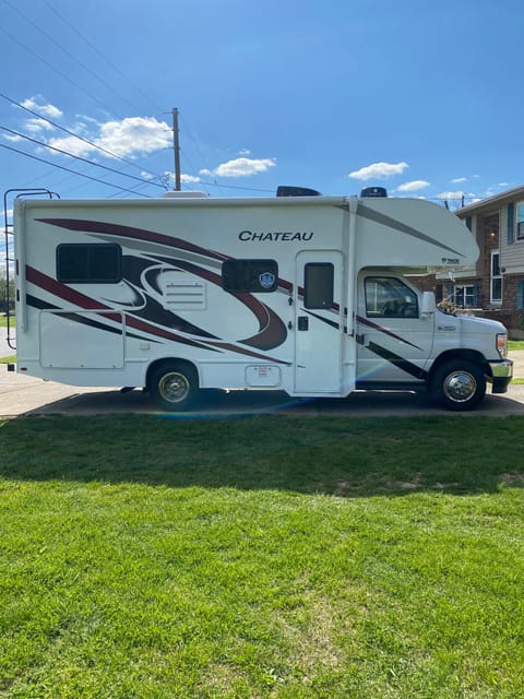 Side view of RV has a regular door and screen door 