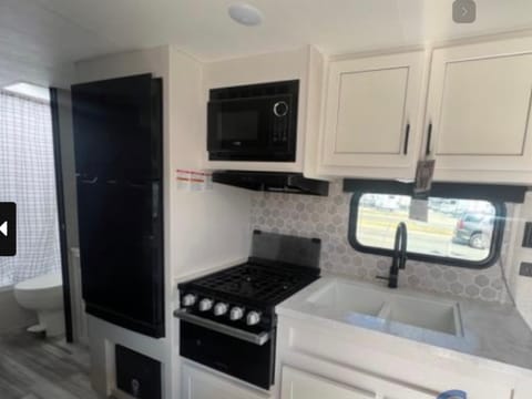 The fridge can run with or without power on the go, microwave, stovetop and oven  in the kitchen. 