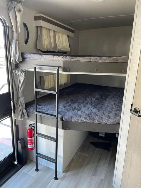 Double bunk beds with windows for the perfect view, bunks are sized for an adult or two kids. Bunk size 48" x 78", extra storage under bunks. 
