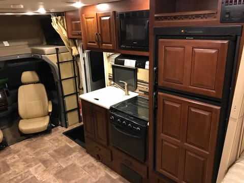 Kitchen with Microwave, Stove and Refrigerator