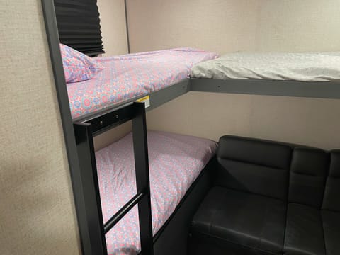 "Johnny Appleseed" is very family oriented with a separate bunkroom. Electrical and USB charging outlets and ample storage space are located in the room. The sofa also converts into a sleeping area.