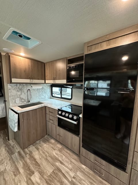 Kitchen with a TON of storage! 8 cubic foot refrigerator with separate freezer. 