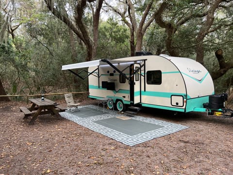 Awning is electric - easy to retract while you're away in the parks.