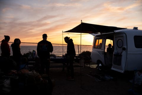 
Marshmallow comes equipped with a Shady Boy suspension awning, ideal for lounging and hanging out with friends and family while staying cool. As the sun sets, enhance the ambiance with solar string lights, providing both coziness and practical lighting for your travel trailer rental experience.