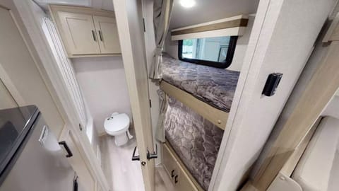 Inside picture of the bathroom and bunk beds in the RV Geo Pro Trailer 