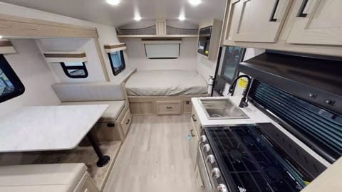 Inside the RV Geo Pro Trailer with the full size bed 