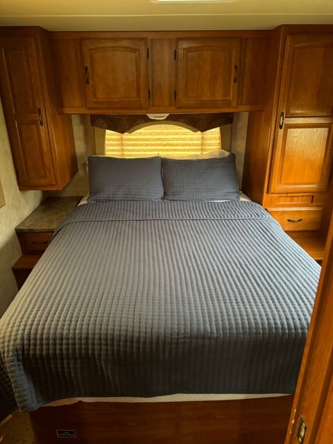 Queen size mattress - very comfortable! Room to walk around either side of the bed and storage on each side. Built in nightstands for convenience. 