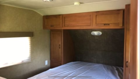 Master sleeping quarters- Nice Queen size bed with a curtain