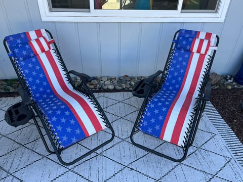 Shown here are the Two American Flag Zero Gravity Reclining Chairs that are available as an Add on