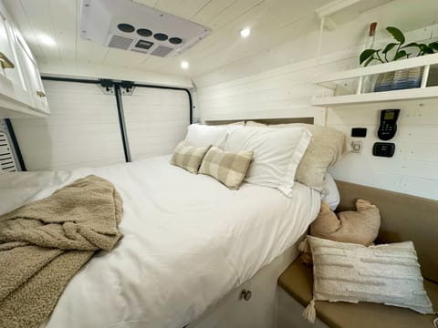 Cozy queen bed with a bunk window! 