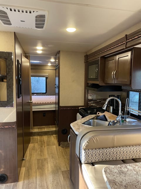 separate master bedroom from the rest of the RV.  Table folds down to make an additional bed. 