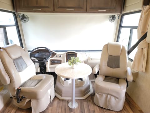 Comfortable vinyl bucket seats and table in cockpit