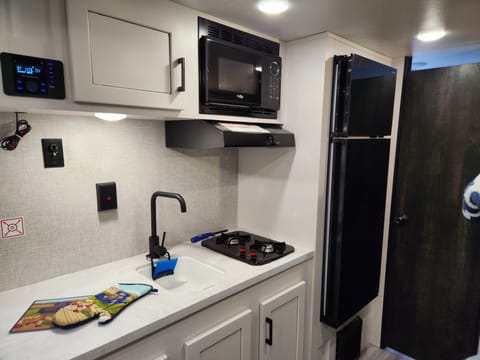 Convenient and efficient cooking.  2 burner gas stove and a microwave. 