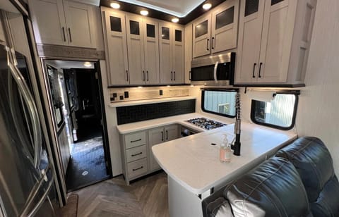 Full Kitchen
Residential size Fridge/Freezer
Microwave
Oven
Three Burner Range
TONS of storage
Door to rear Toy Hauler/Sleeping Area
