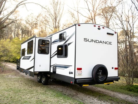 Comfort meets outdoors with this 2022 Sundance. Enjoy all of the amenities of home but in the great outdoors. Listen to music inside or out with the 2-zone speaker system. Sleeps 10: 2 comfy bedrooms (one with a Queen bed and one with 3 bunks); a booth that turns into a bunk; a convertible kitchen table; a couch that pulls out into a bed. Full-size shower and plenty of space for everyone with a big slideout. Lights everywhere for at night and an outdoor cooking griddle built-in with plenty of storage and an outdoor fridge too! 