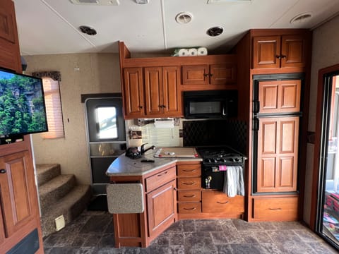 Kitchen has fold up counter for more cook/prep space