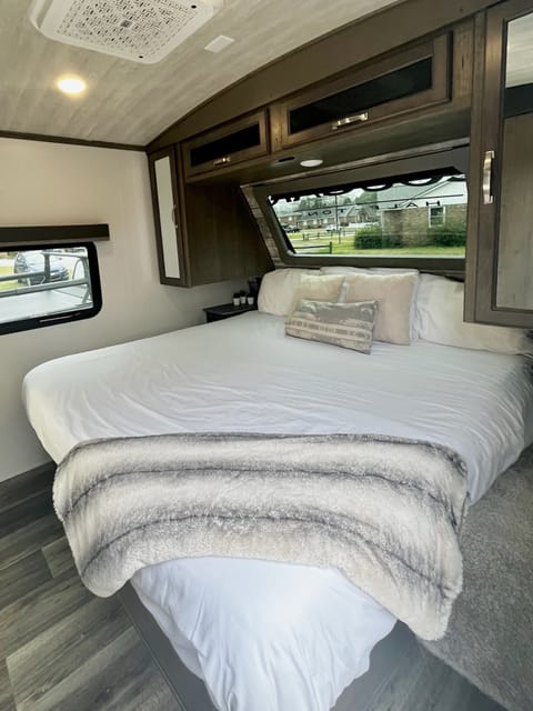 Primary Bedroom— King bed
Storage under bed and updated storage shelves on both sides of the bed. 
TV dedicated to the space as well. 