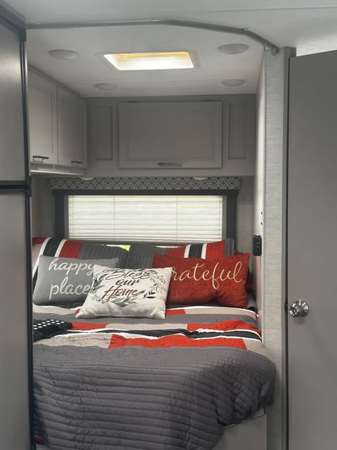 Queen bed nestled in back. Sleeps two comfortably. Memory foam topper added for extra comfort. 