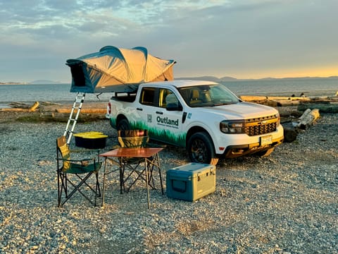 Our Ford Maverick with the Thule Approach M Roof Top Tent. Enjoy all-terrain capabilities, best-in-class fuel economy, and compact size for nimble exploration. With all the camping equipment provided, your journey promises to be both economical and effortless!