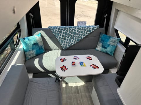 Family friendly lounge and dining area with Lagun table for games, meals, or hanging out. BOSE sound bar makes this space fun, and the AC or heat make it comfy in any weather.
