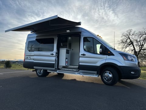 Huge awning, plenty of fresh water, plus bug nets on the side door and rear door. Whisper quiet AC runs on unlimited generator hours or huge 600 amp hour lithium to run the AC quietly in stealth mode all night. Just fun to drive and Transit has safety and comfort features galore.