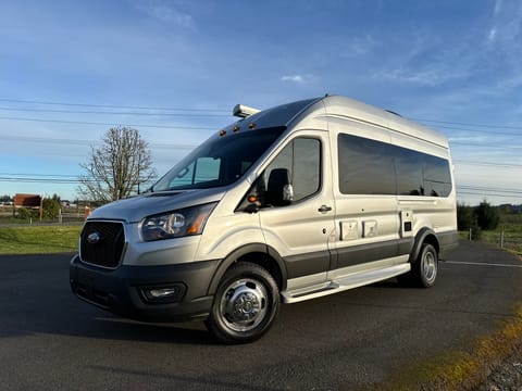 A gorgeous van! Easy access to outdoor shower and utility hookup at campsite. Tank dump and valves are accessible under the edge flare. Plus, this has a quick-connect propane port to get your grill or camp stove going.