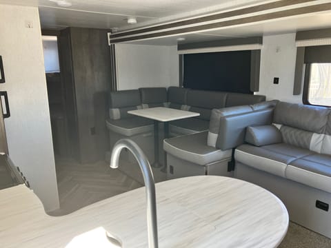 Kitchen, dinette and couch.