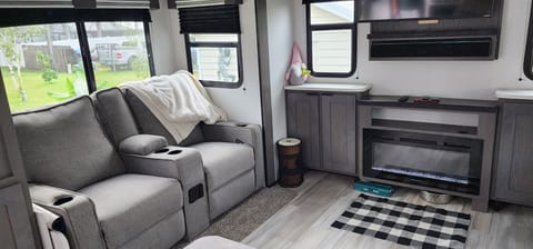 2021 Cruiser RV MPG Ultra Lite has large living room with fireplace. Towable trailer in Charlotte Park