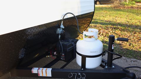 propane tank, battery, chains, power cable. 30 Amp service.