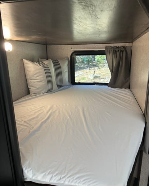 Roomy lower bunk with emergency exit window.