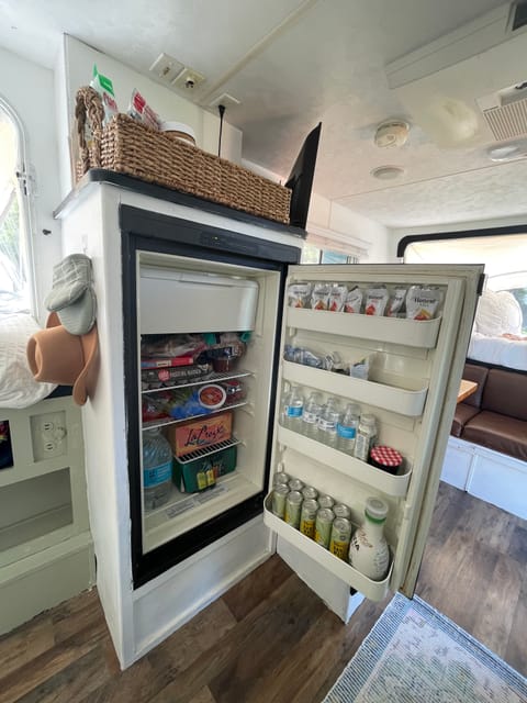 A large fridge with enough space to store your favorite snacks and ingredients to cook up your favorite camping meal. 