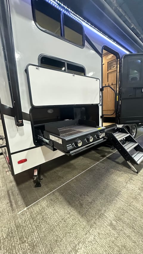 Outdoor grill and griddle. Mini fridge. 