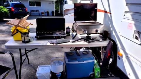 Outdoor cooking station with everything you see included! Even the outdoor dish washing set up!