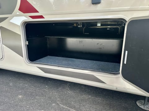 Underbody storage, reaches to other side.