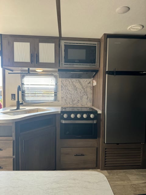 Full kitchen with large fridge and freezer 