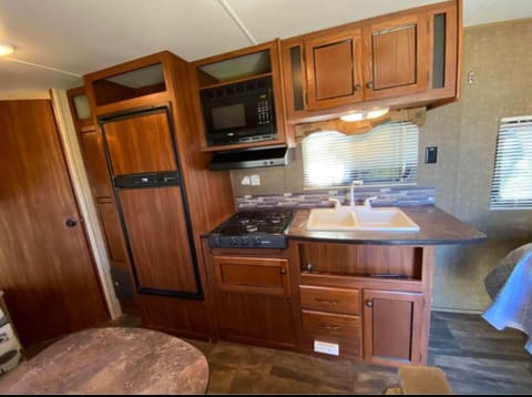 Kitchen with refrigerator and freezer. 