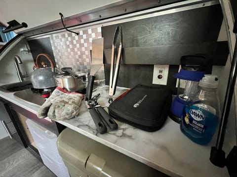 I have included dish soap, an electric lantern, knife and cutting board set, tongs, a spatula, saucepan, tea kettle, and an oven mitt to every rental. 