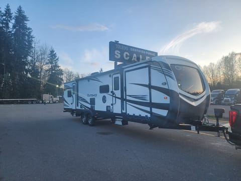 2019 Outback 342cg - Toy Hauler door drops down and can be used as a raised patio, front door access main living space and back door access the bedroom with King bed.