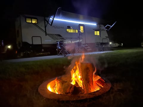All this picture needs is you and your family relaxing around the fire, enjoying time together on a clear summer evening. Maybe having some S'mores or some of your favorite camp snacks or activities.