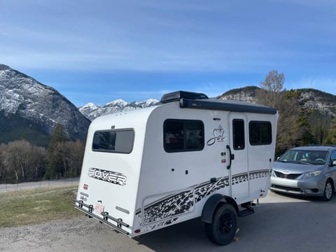 The rover package includes the power awning and the receiver for a bike rack rated up to 175 pounds.