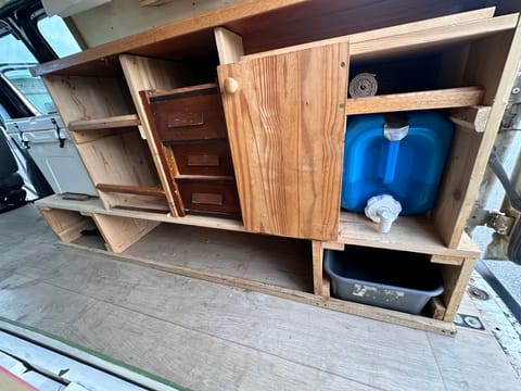 Plenty of space for dishes, cookware, spices and more! Bins will be added to all storage compartments