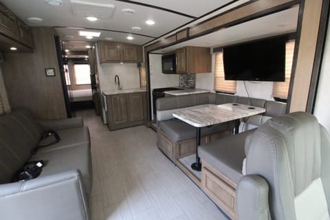 BEST floor plan for dinner, hang-out, board games, and it's hard to find! Most RVs have the couch and table on the same wall.