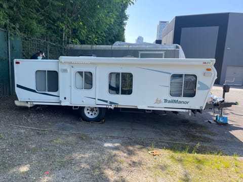 When we're not using the trailer or driving it to your site the trailer is in it's folded down position. It's not a tent trailer as it is a fully hard shelled trailer. A lot of people name their trailers the Transformer because it changes so much with a couple of pulls. Another good name is the TARDIS because it's bigger on the inside (once set up).