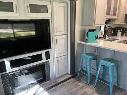 Bar with stools for enjoying inside meals.