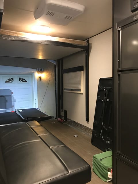 Cargo area, queen bed electrically lowered. 