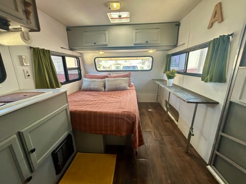 Fully remodeled trailer boasting abundant natural light and a cozy atmosphere.