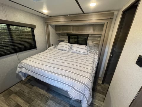 King bed in the back of the camper