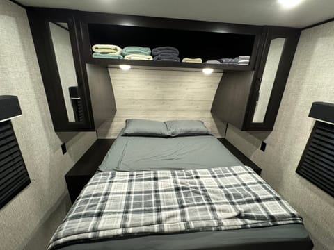 Queen bed with closet space on either side as well as under bad storage!